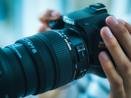 a person taking a picture with a camera