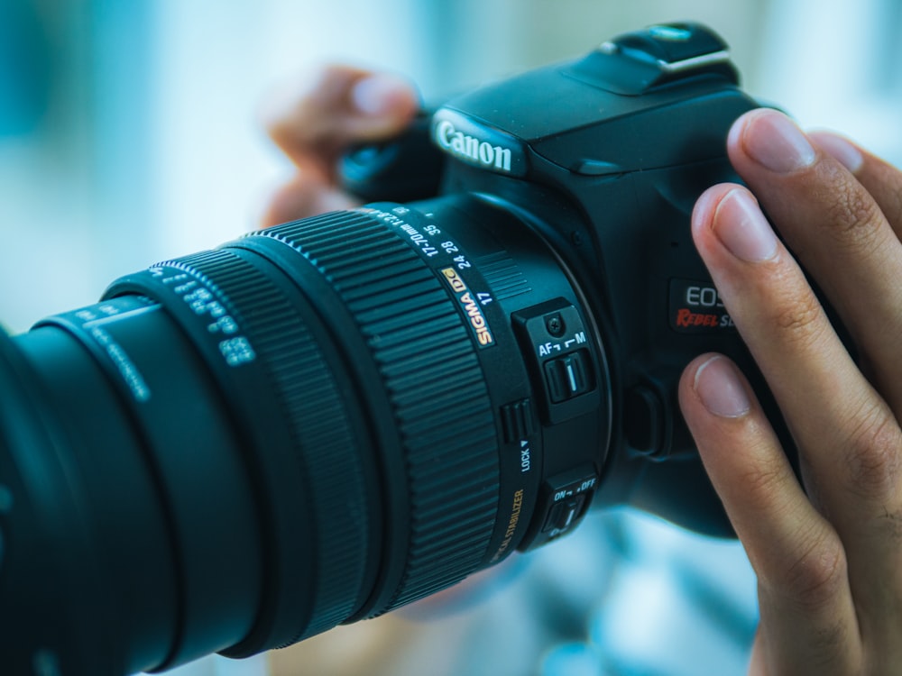 a person taking a picture with a camera