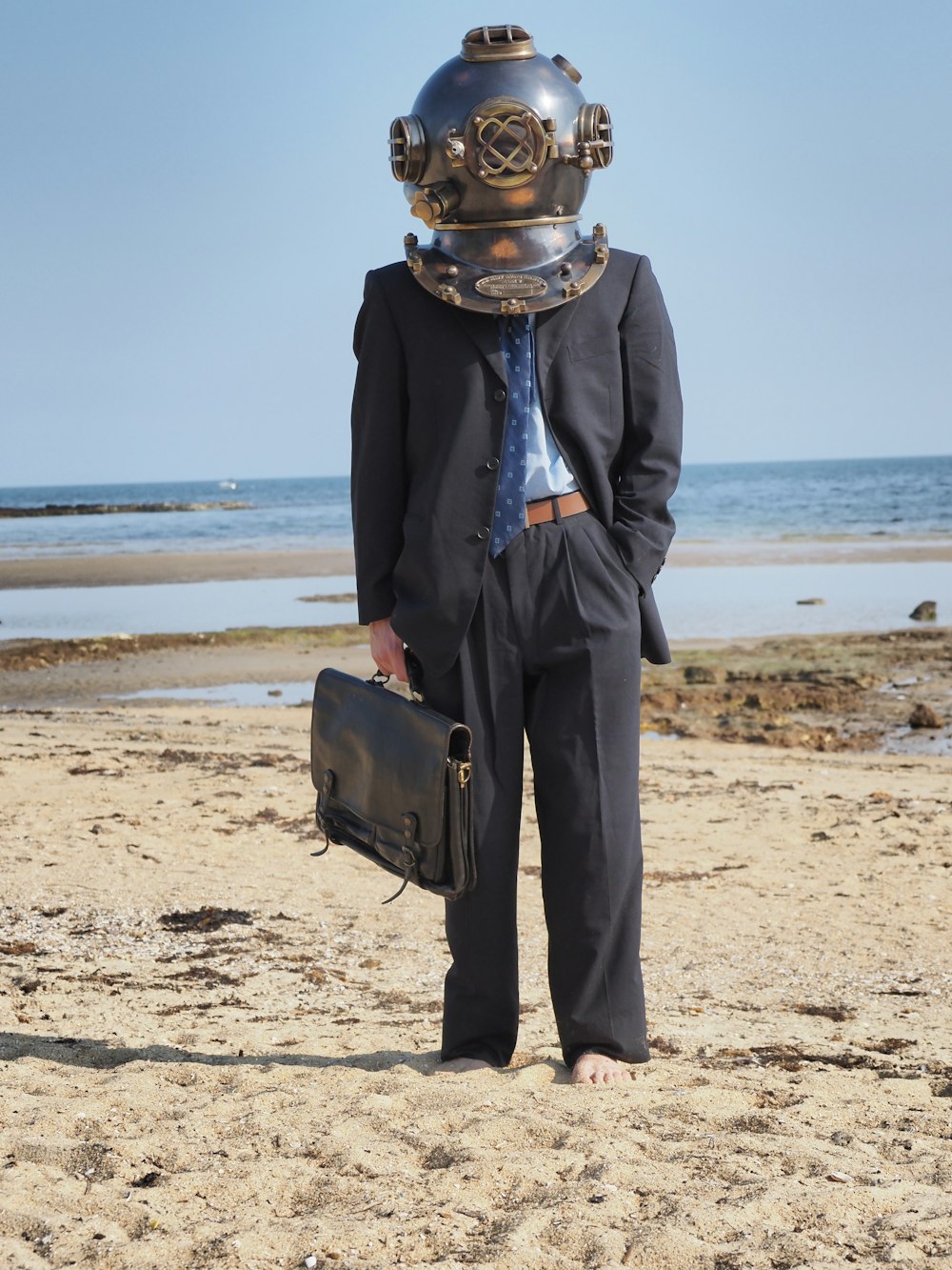 a man wearing a suit and a diving mask
