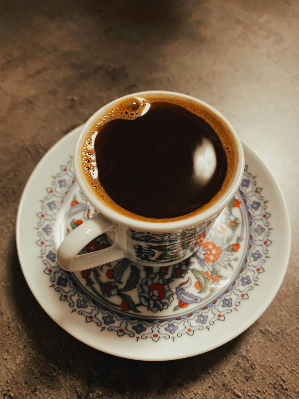 a cup of coffee sitting on top of a saucer