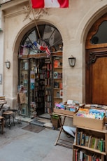 a book store with a flag flying outside of it