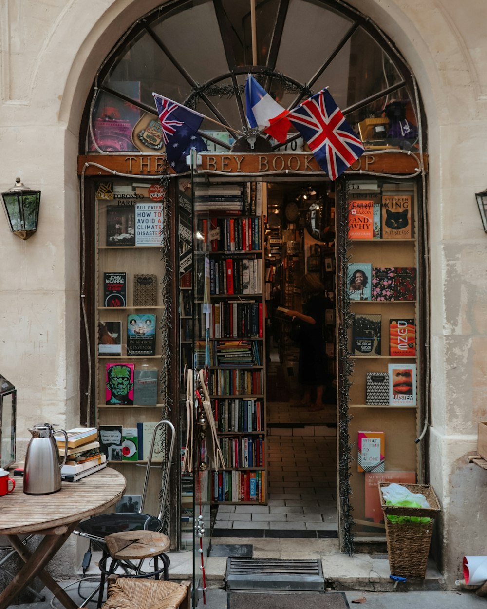 a bookshop with a table and chairs outside of it