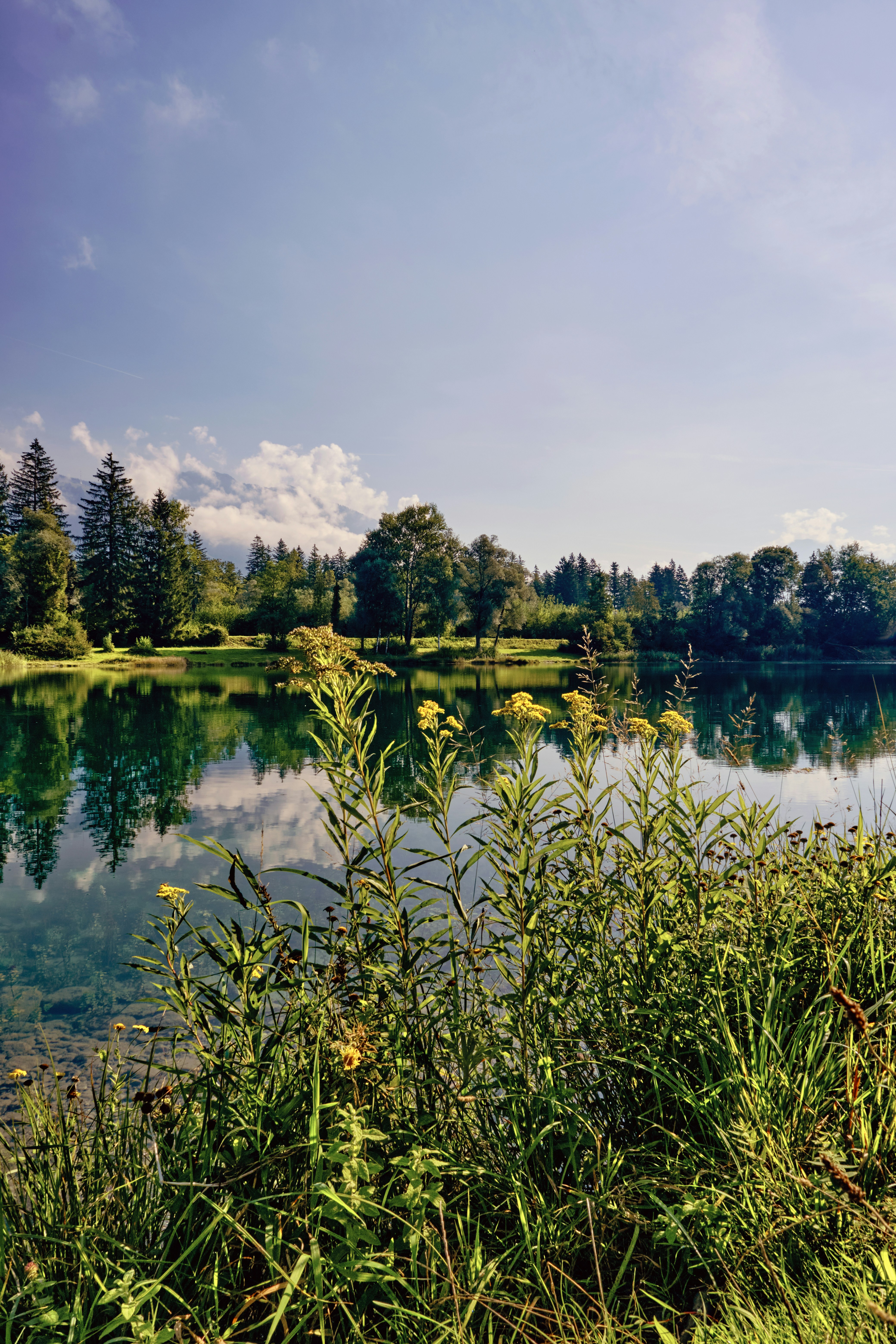 Pristine waters of Chouwen Lake surrounded by lush greenery