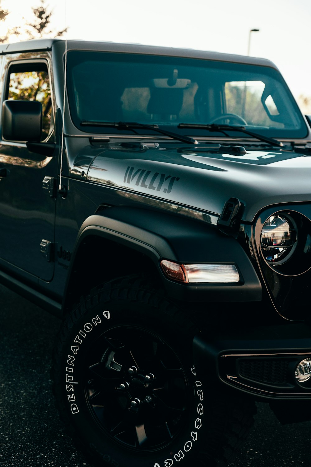 a black jeep parked in a parking lot