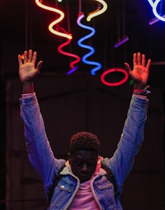 a man with his hands up in the air