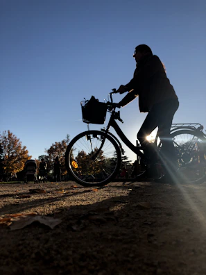 a person riding a bike on a dirt road