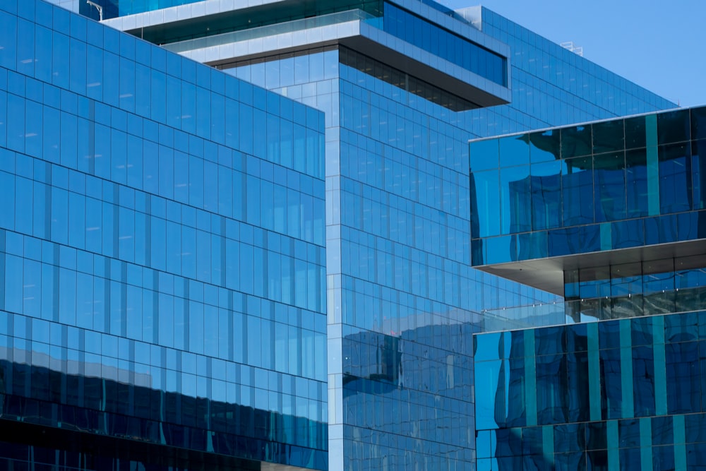 a very tall building with many windows next to it