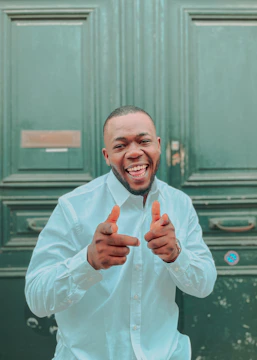 Smiling client showing keys to their new home after loan approval.