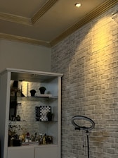 A bright LED spotlight illuminating a modern living room corner.