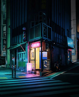 Photo of a minimalist urban street corner at night with neon signs glowing.
