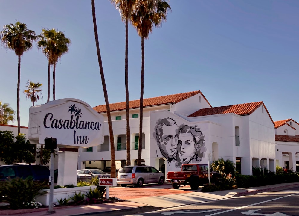 a white building with a picture of a man and woman on it