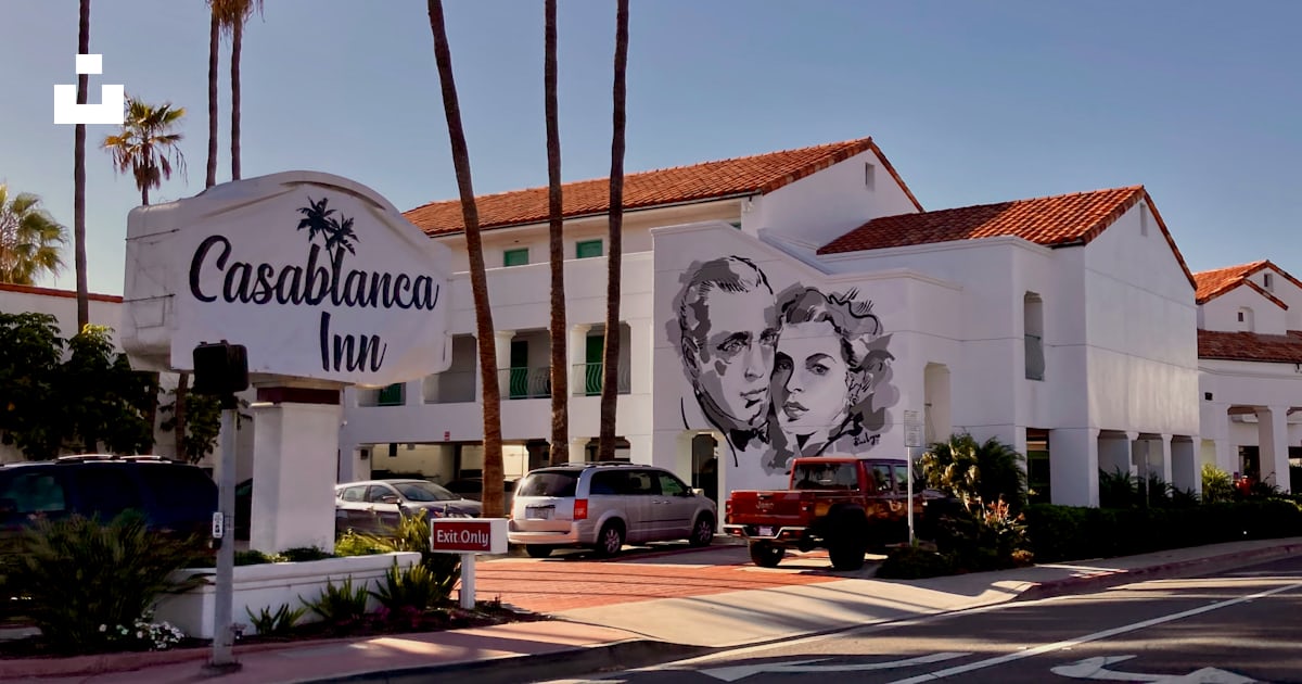 A white building with a picture of a man and woman on it photo Free