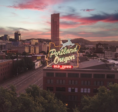 a large neon sign on top of a building