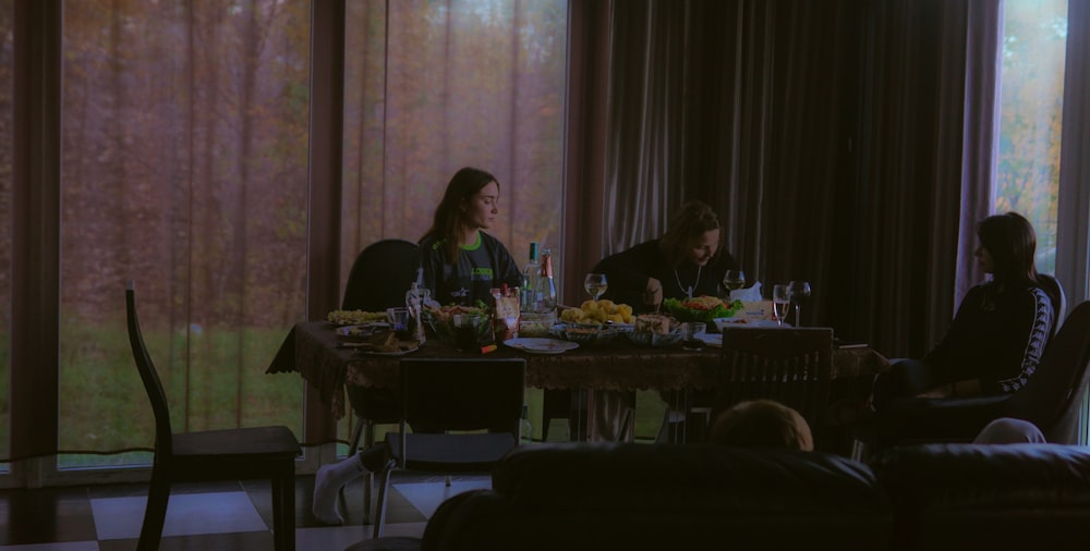 a group of people sitting around a table