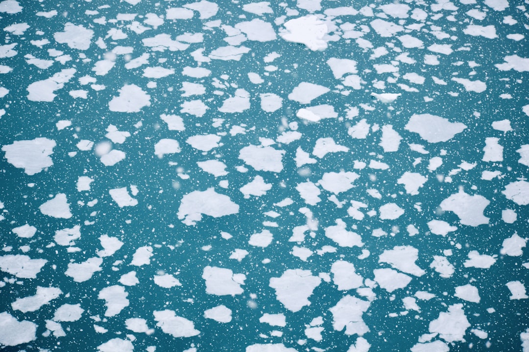 a large amount of ice floating on top of a body of water, Ice & ocean