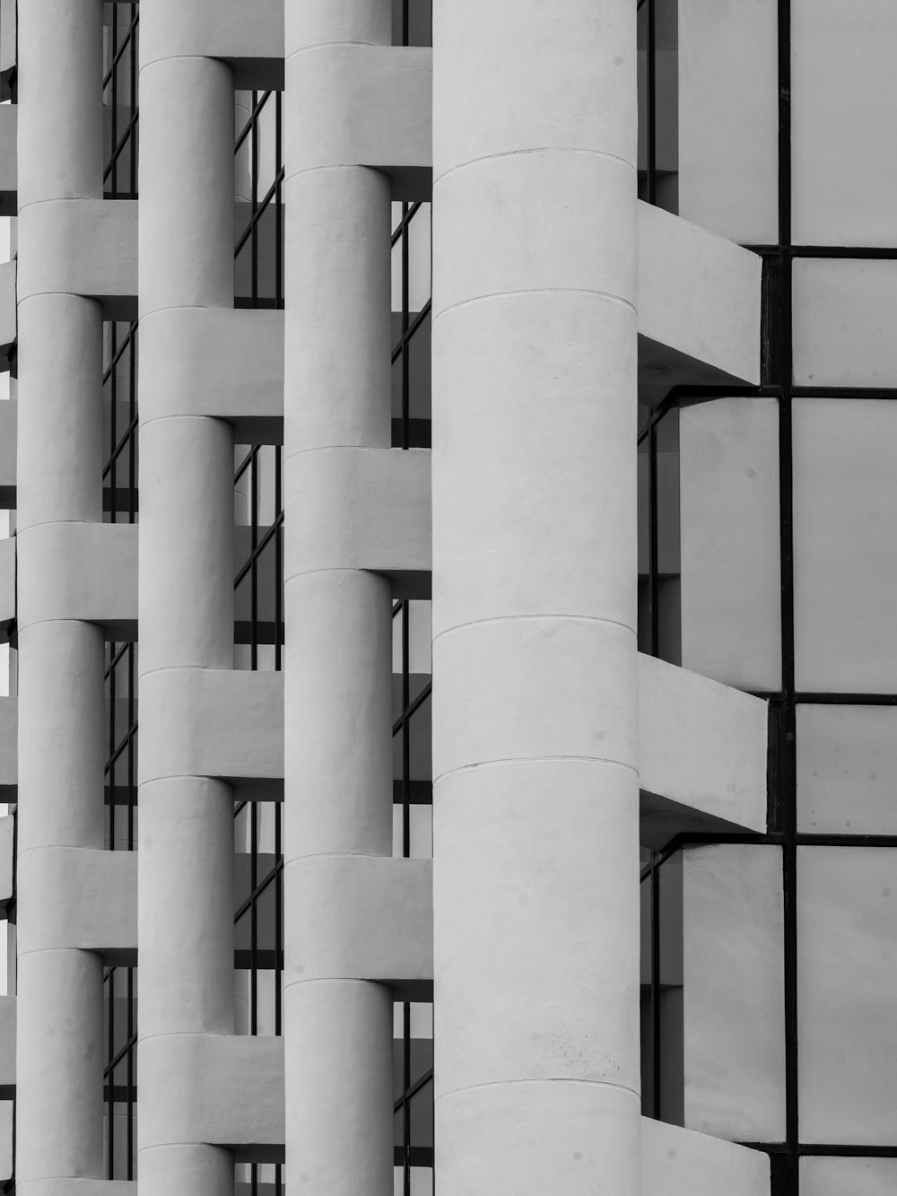 a black and white photo of a tall building