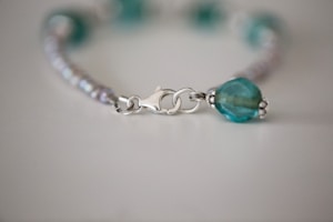 Close-up of a handcrafted bracelet featuring intricate beadwork.