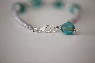 Close-up of a handcrafted bracelet featuring detailed silver work.