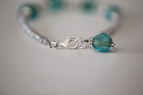 Close-up of a handcrafted bracelet featuring intricate beadwork.