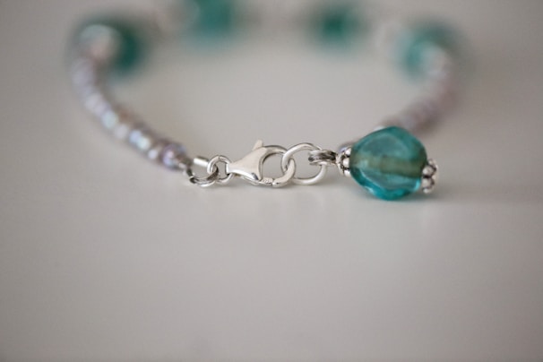 Close-up of a handcrafted bracelet featuring detailed silver work.