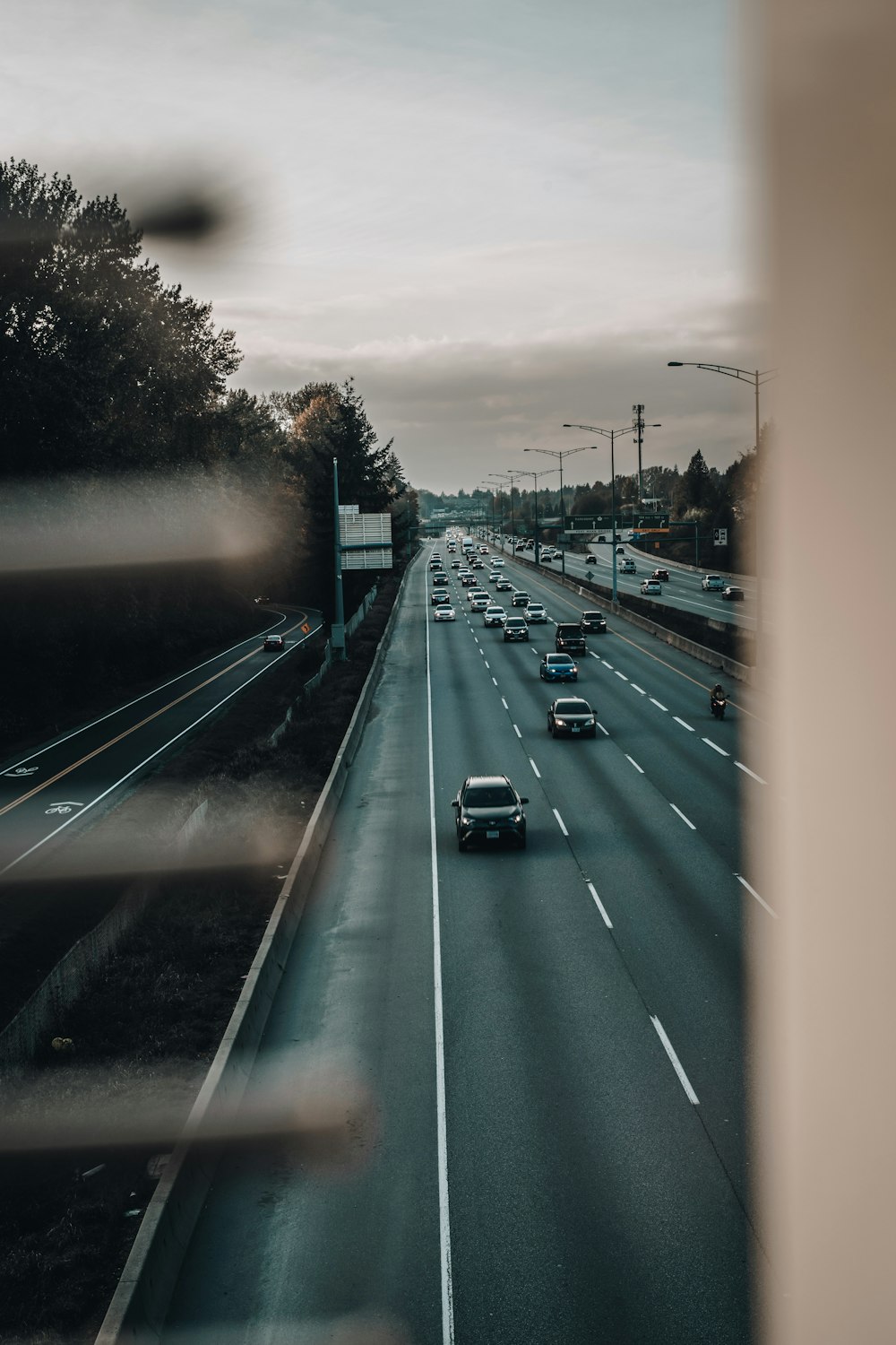 a view of a highway with cars driving on it