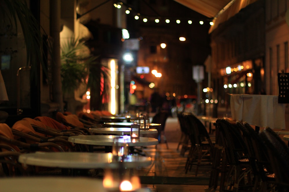 a row of chairs sitting next to each other on a sidewalk