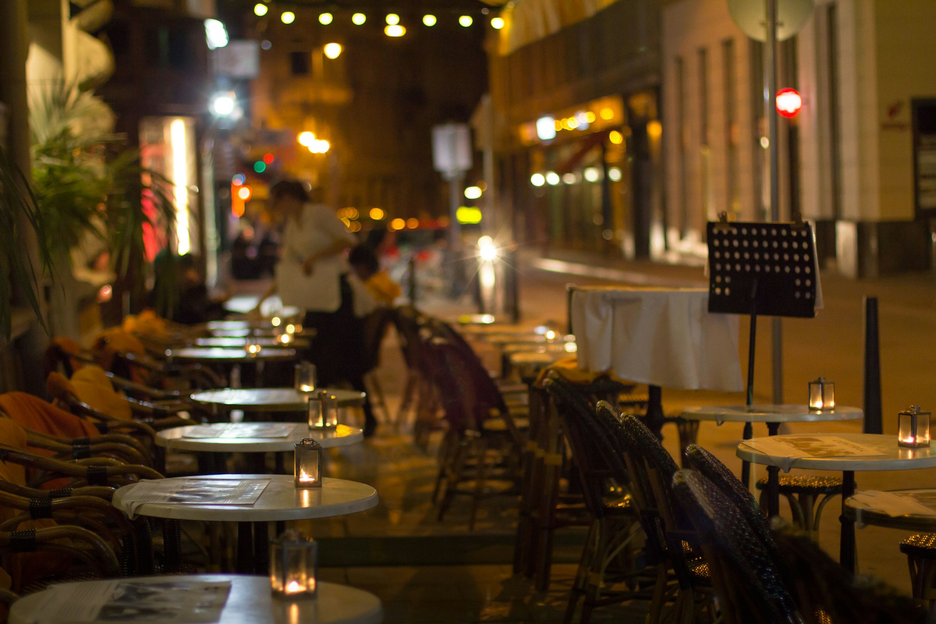 a row of tables sitting on the side of a street
