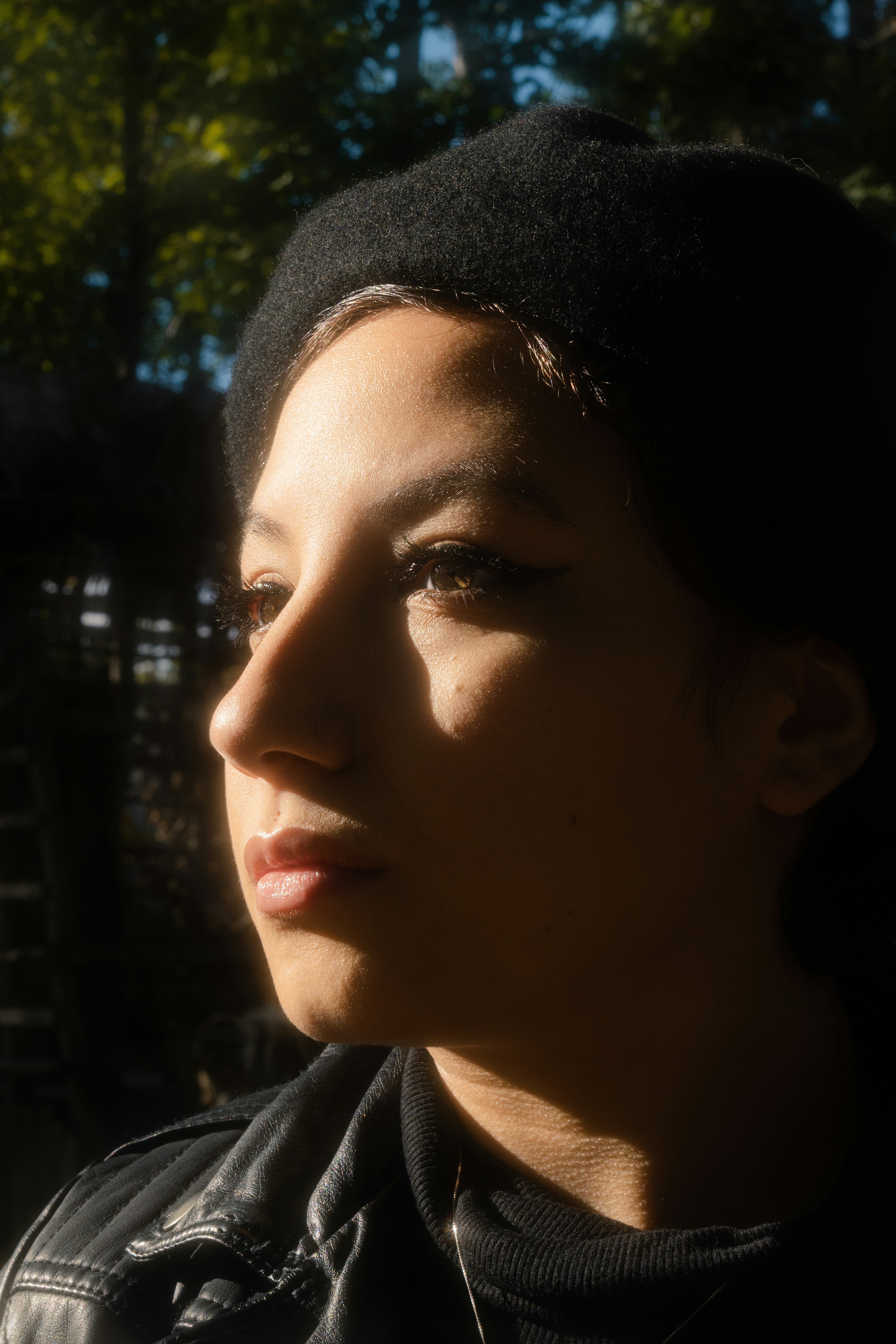 a close up of a person wearing a black jacket