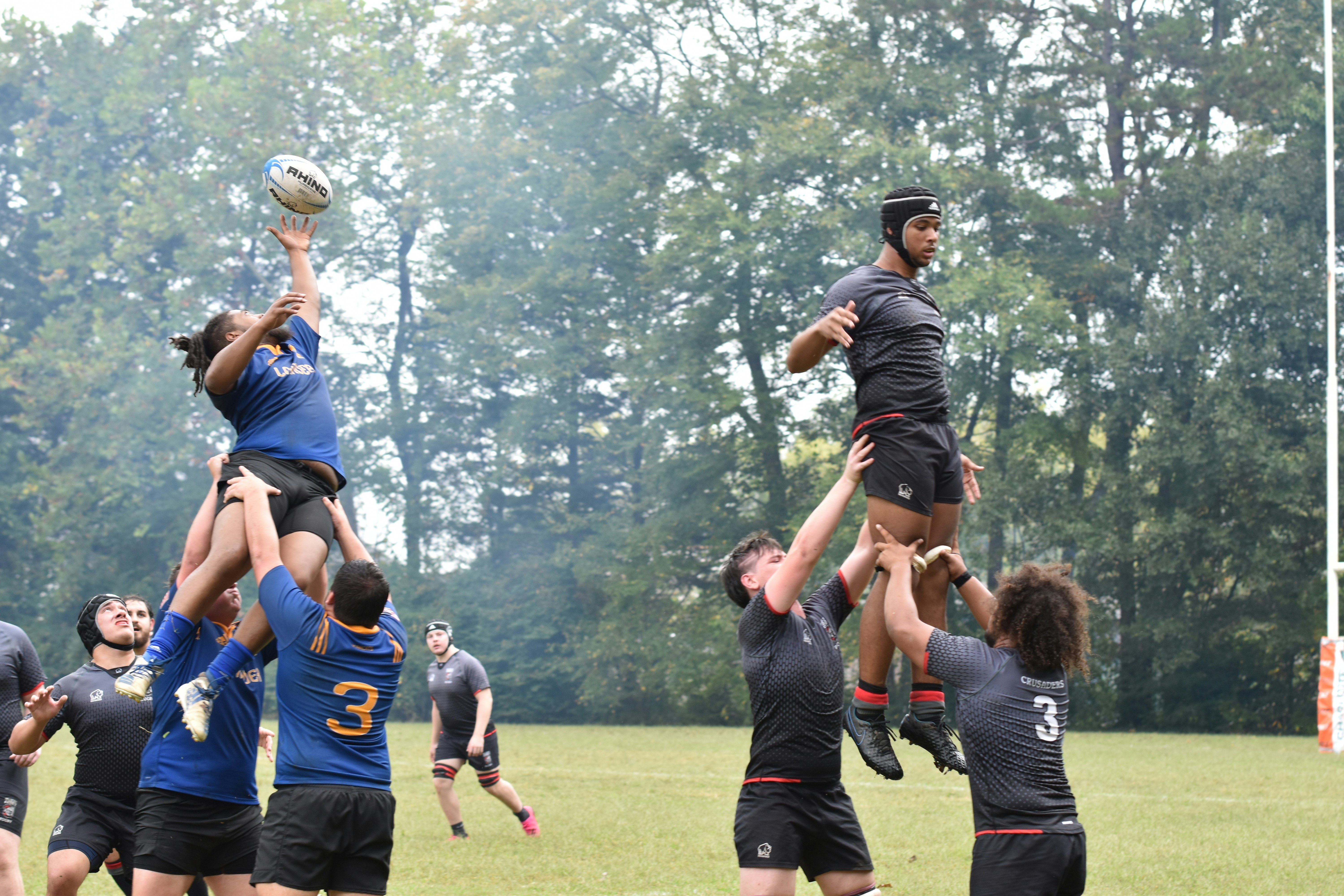 a group of people playing a game of rugby