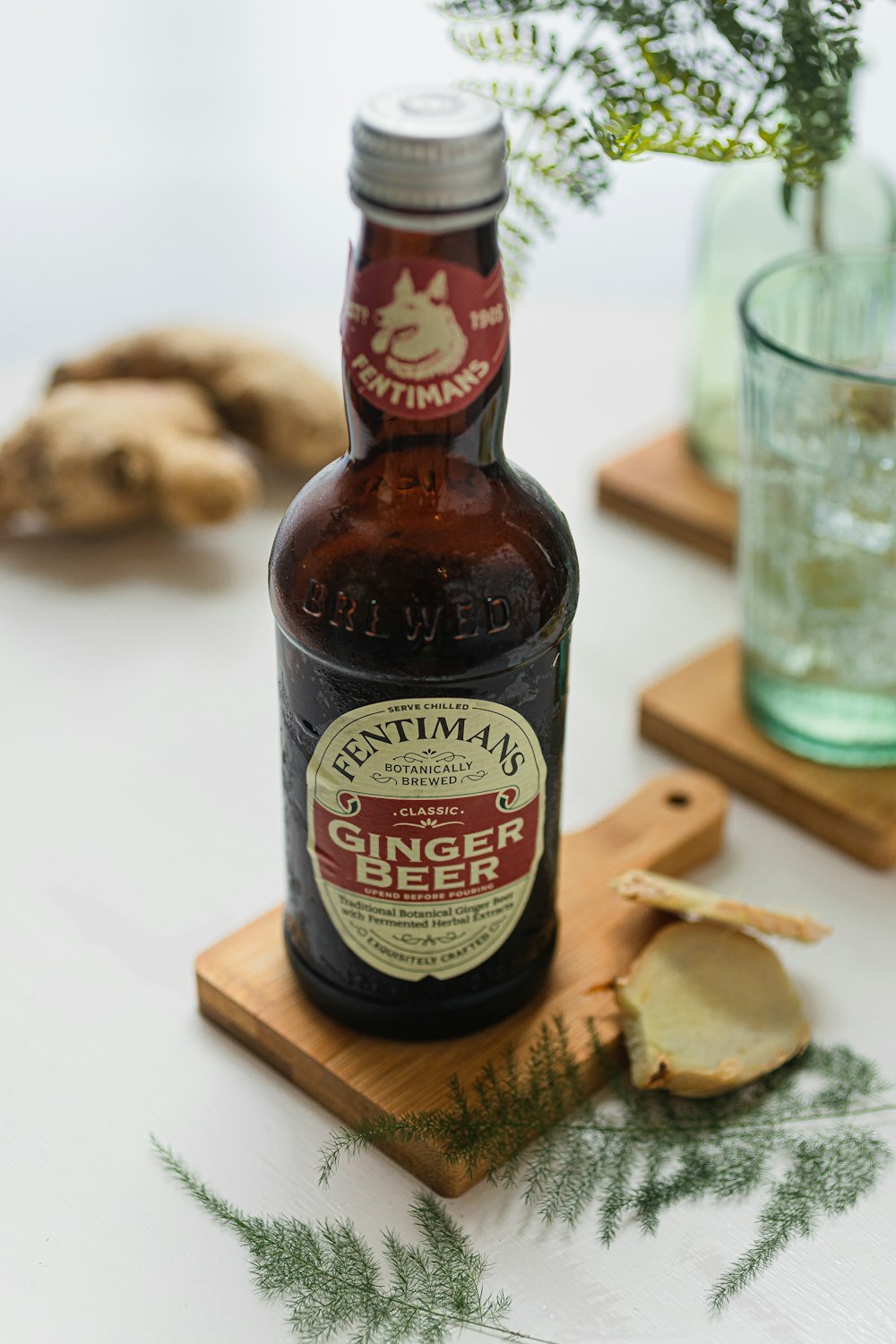 a bottle of beer sitting on top of a cutting board