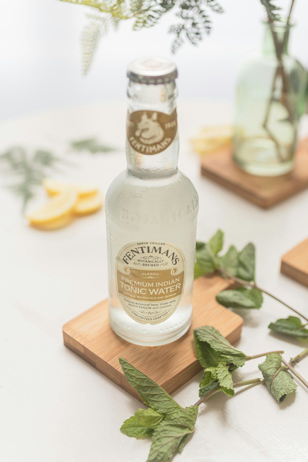 a bottle of water sitting on top of a wooden tray