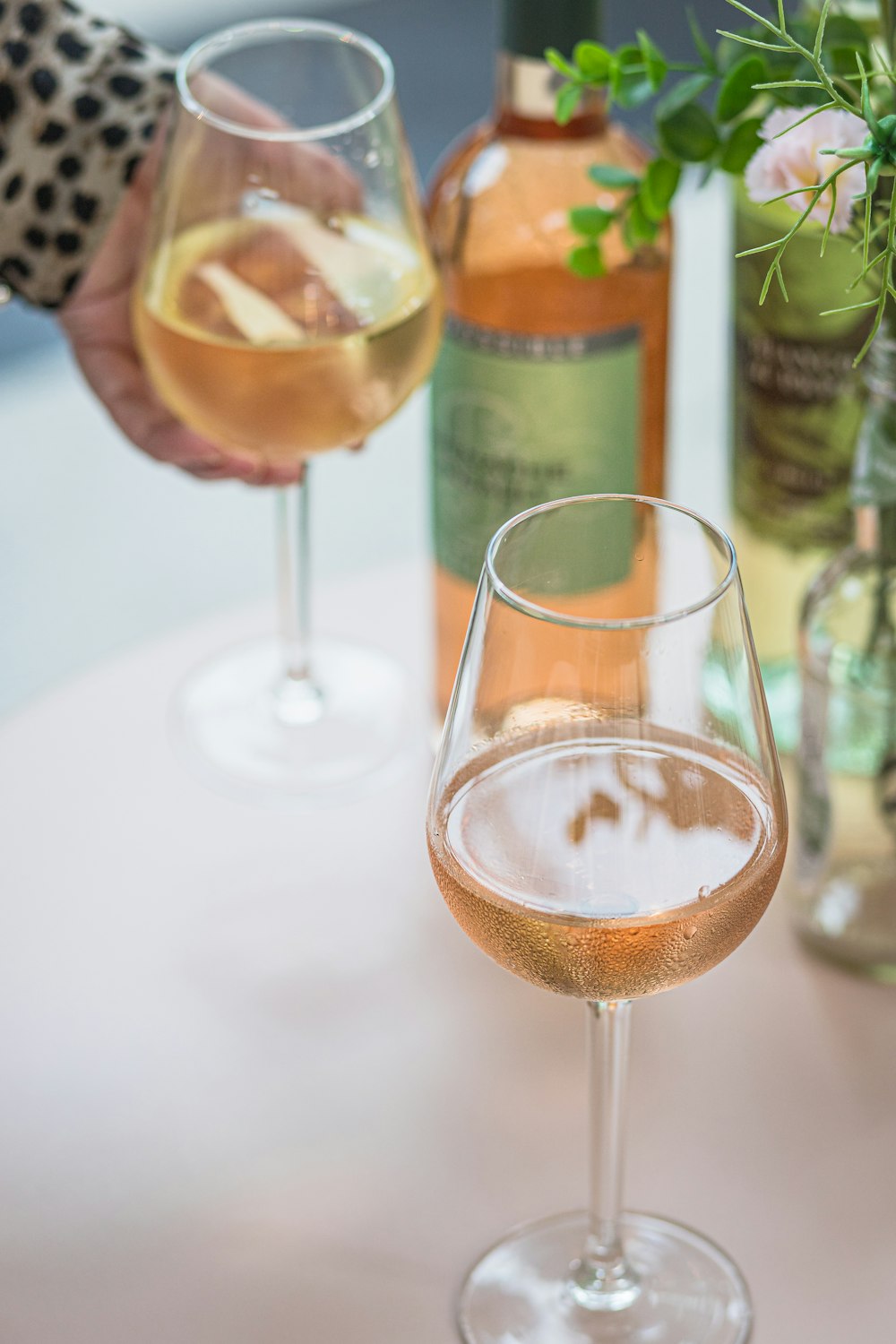 a couple of wine glasses sitting on top of a table