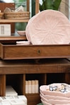 a chair sitting in front of a wooden table