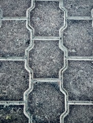 Close-up of a beautifully patterned stamped concrete patio with warm earth tones.