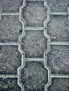 Close-up of colorful paver blocks neatly arranged in a pattern.