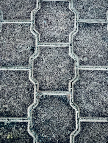 Close-up of freshly installed interlocking pavers with clean edges and natural tones.