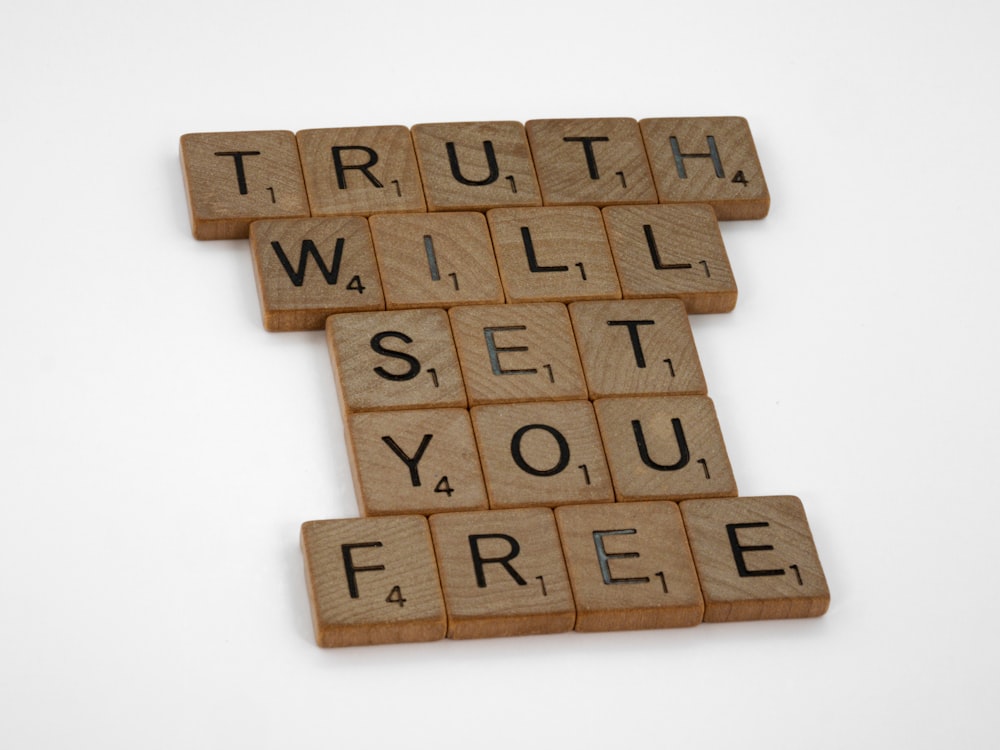a scrabbled scrabble with the words truth will set you free
