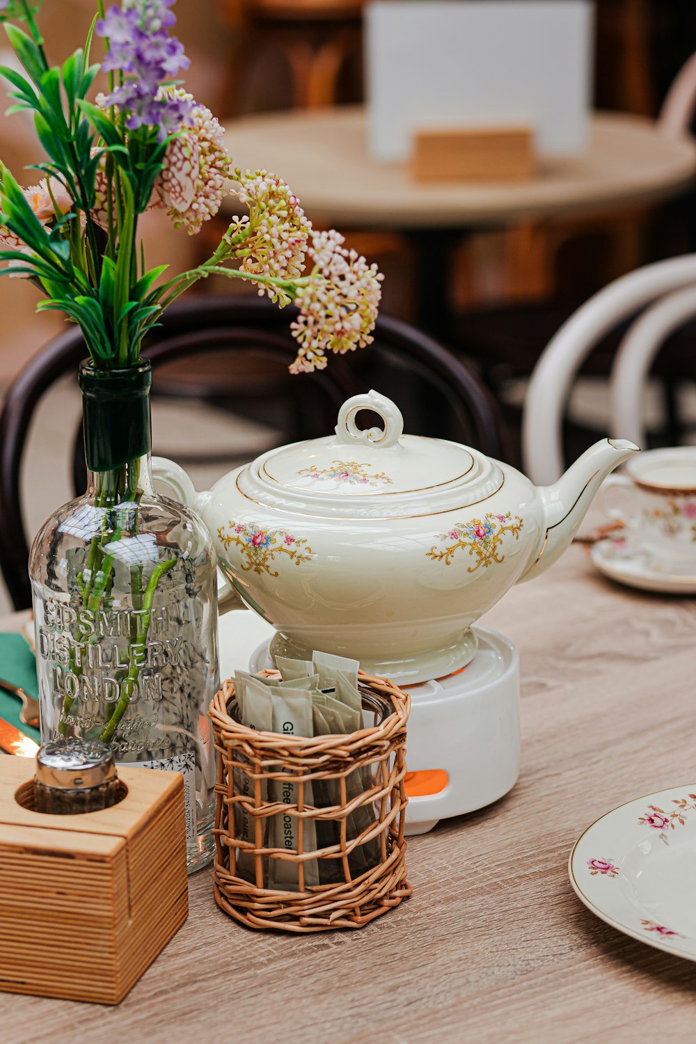 a table topped with a vase filled with flowers