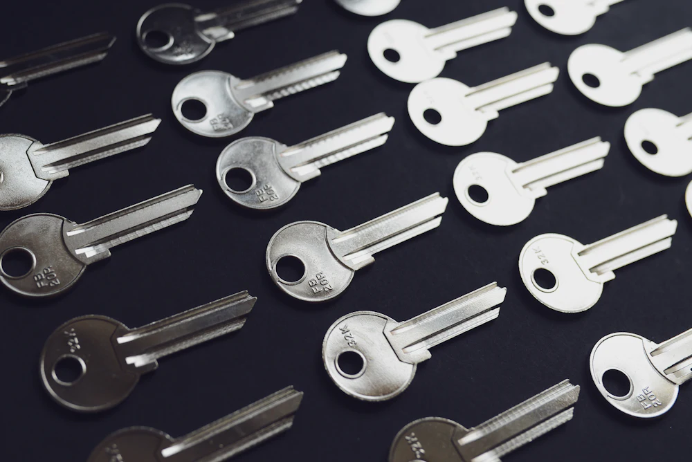 Collection of keys and lock cylinders on a workbench