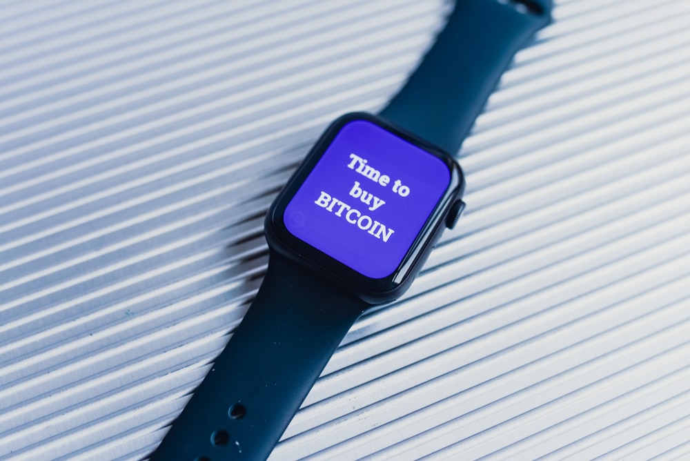 an apple watch with a purple screen on it
