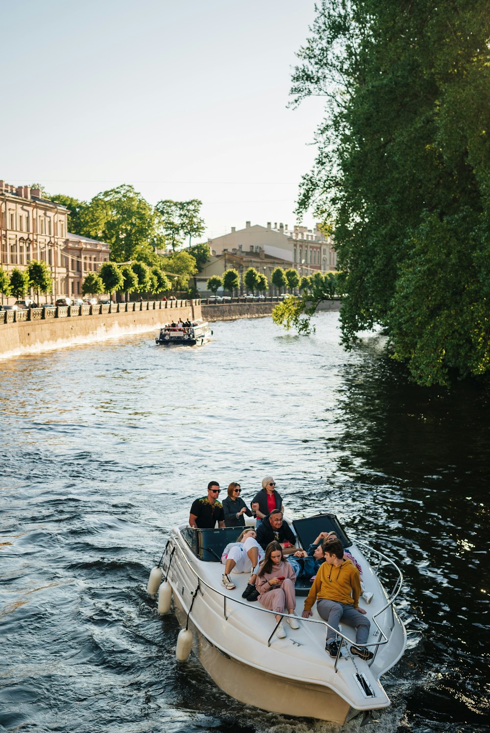 a group of people riding on the back of a boat