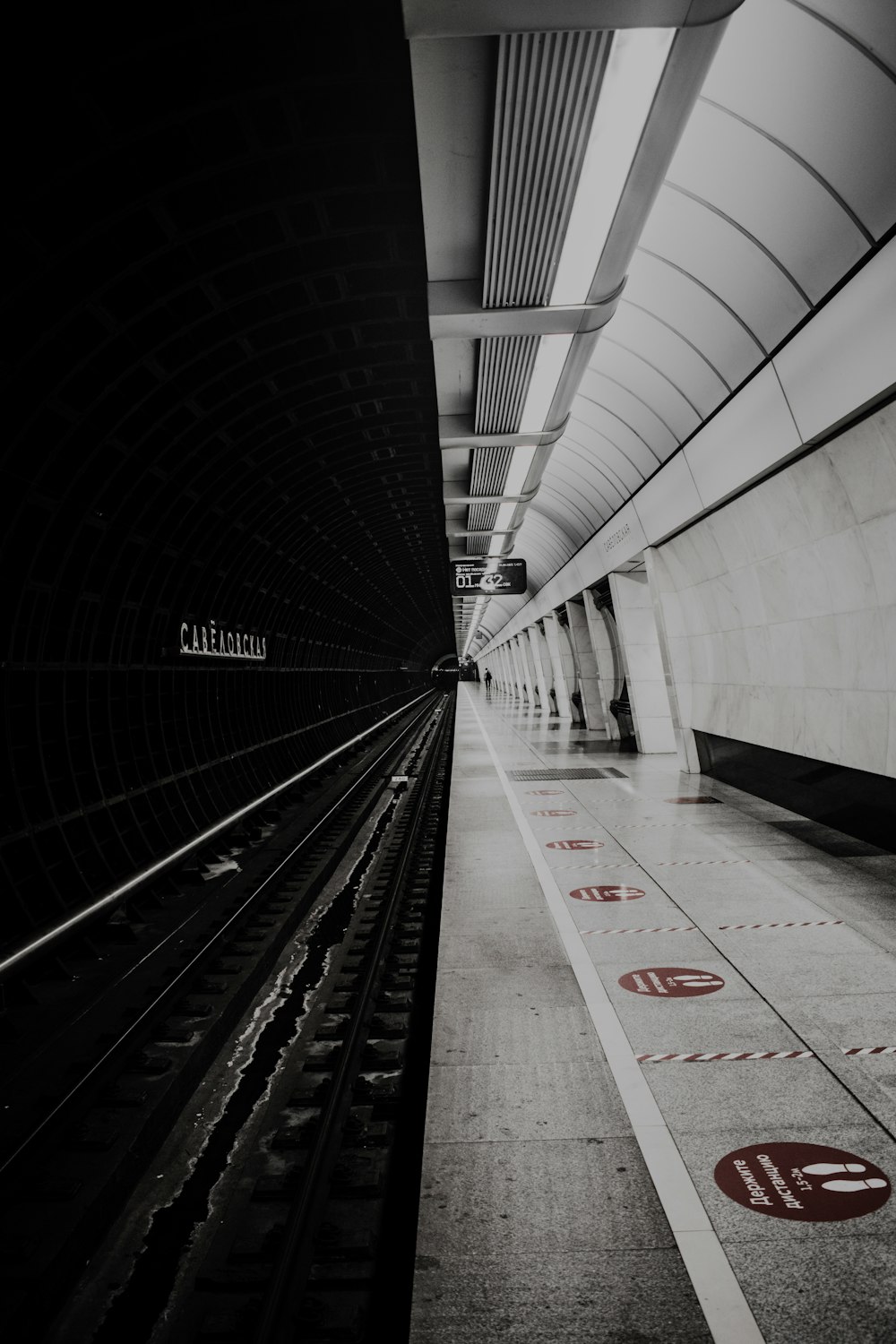 a black and white photo of a train station