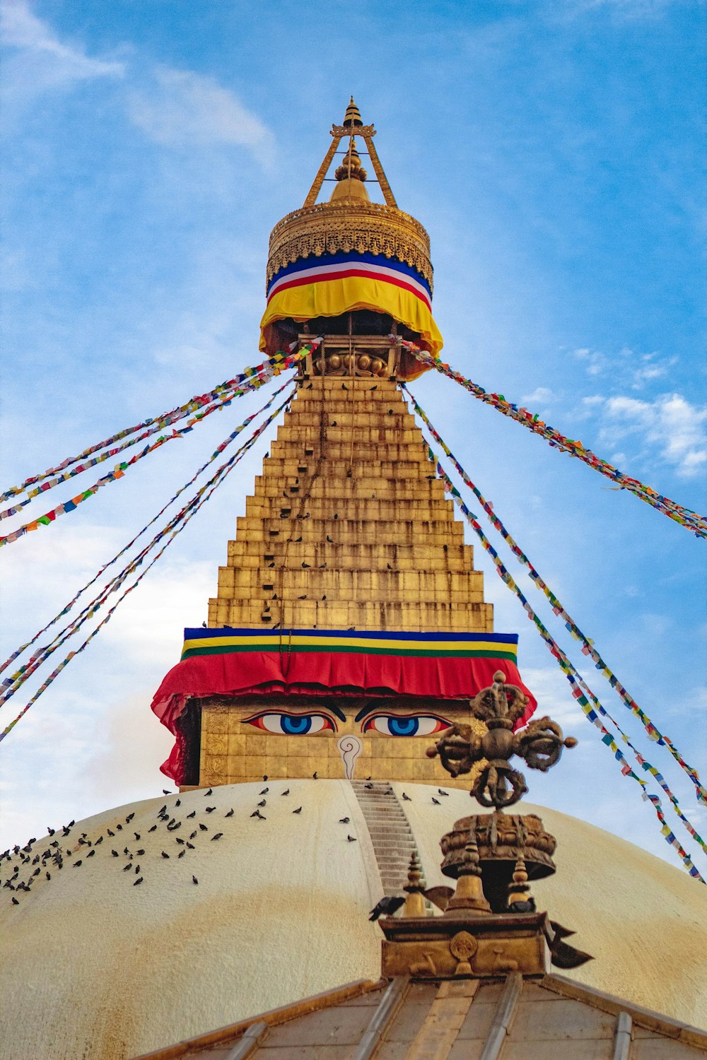 the top of a building with a large statue on top of it