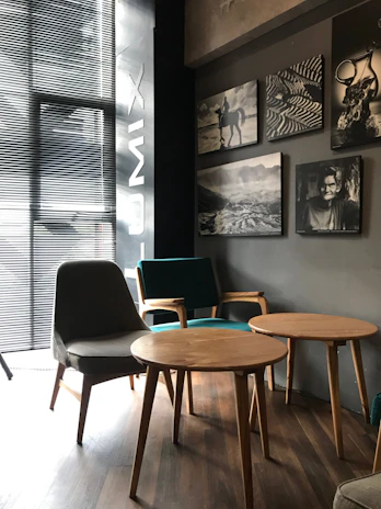 Editorial-style photograph of a boutique hospitality space with warm black and taupe tones.