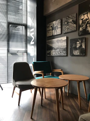 Cozy Scandinavian-style restaurant interior with warm lighting and elegant black and white tones.