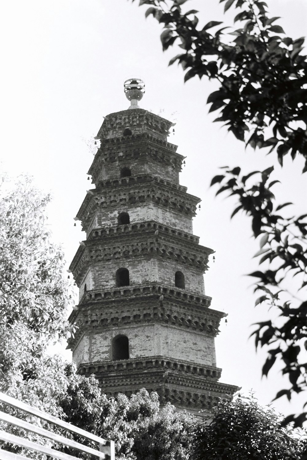 a black and white photo of a tall tower