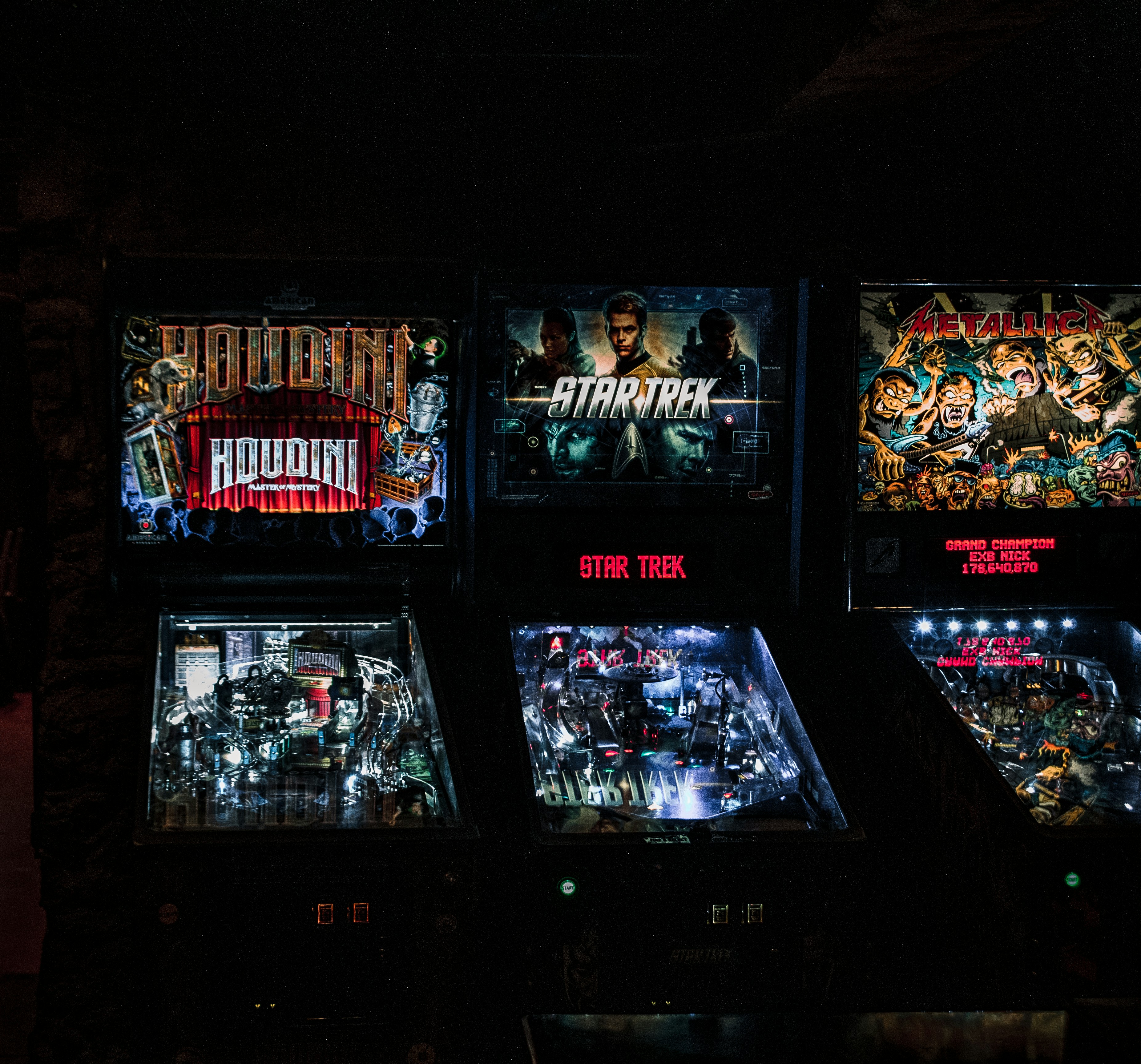Pinball machines in basement bar.