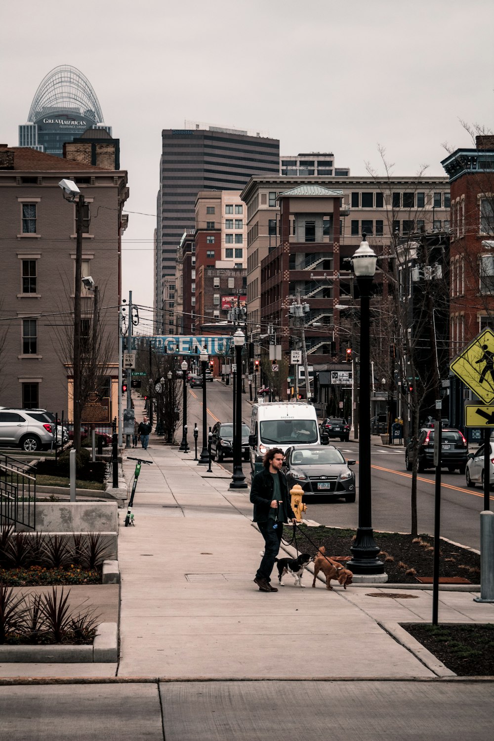 a person walking a dog down a sidewalk