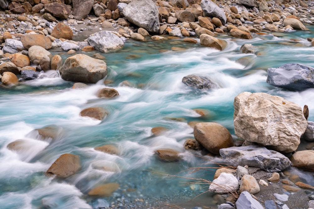 a river with rocks and water running through it