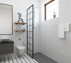 a bathroom with a toilet, sink, and shower